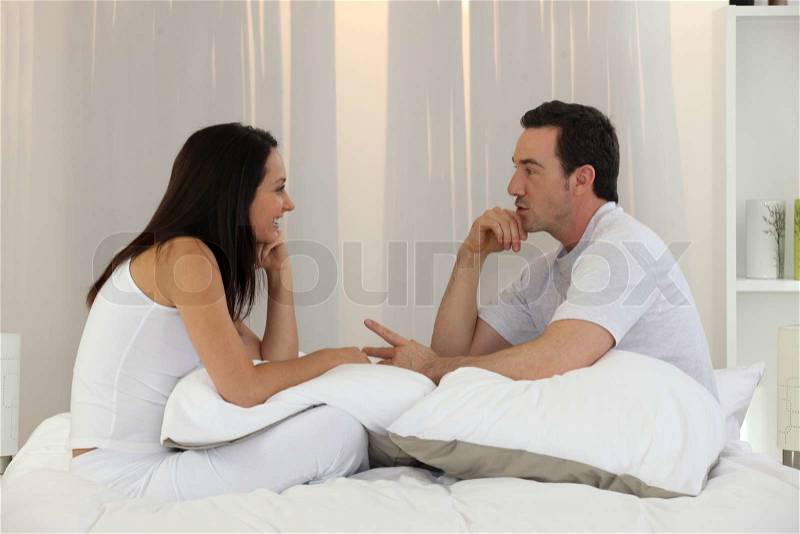 Married couple having an intimate discussion, stock photo