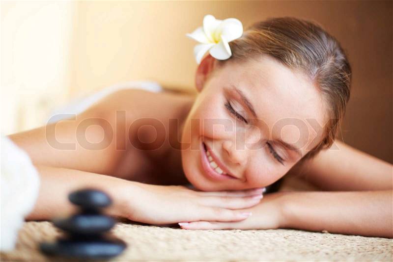 Portrait of young female ready for the procedure of massage, stock photo