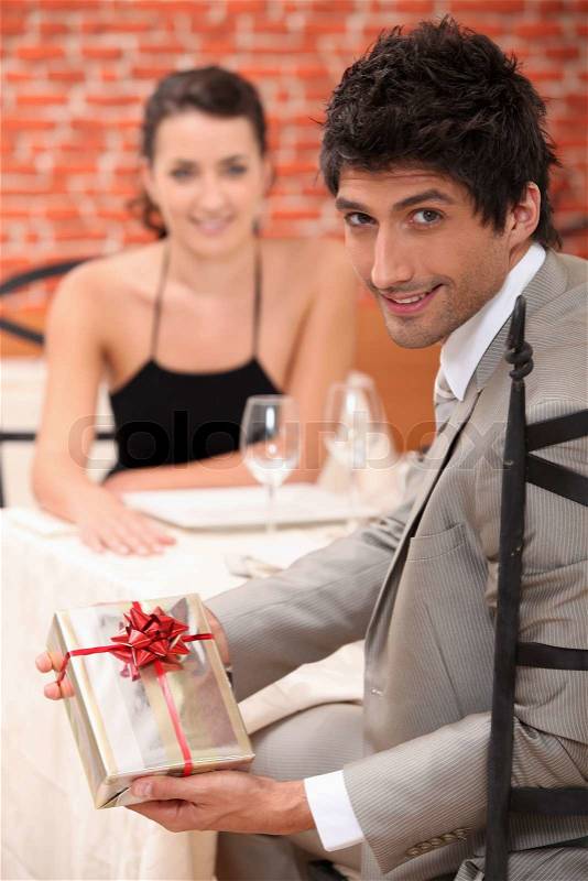 Man giving gift to woman, stock photo