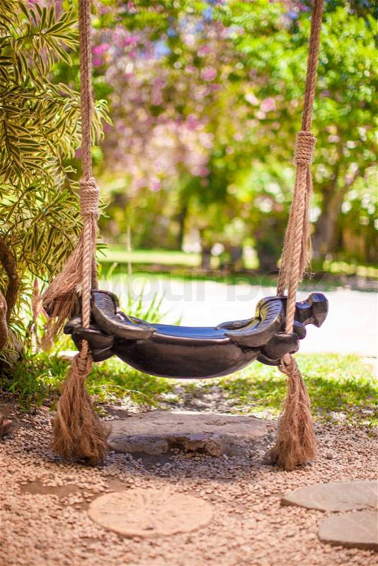 Close-up of a beautiful swing in the garden, stock photo