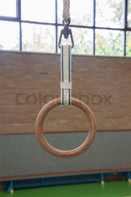 Gymnastic ring, interior of an old school gym, stock photo