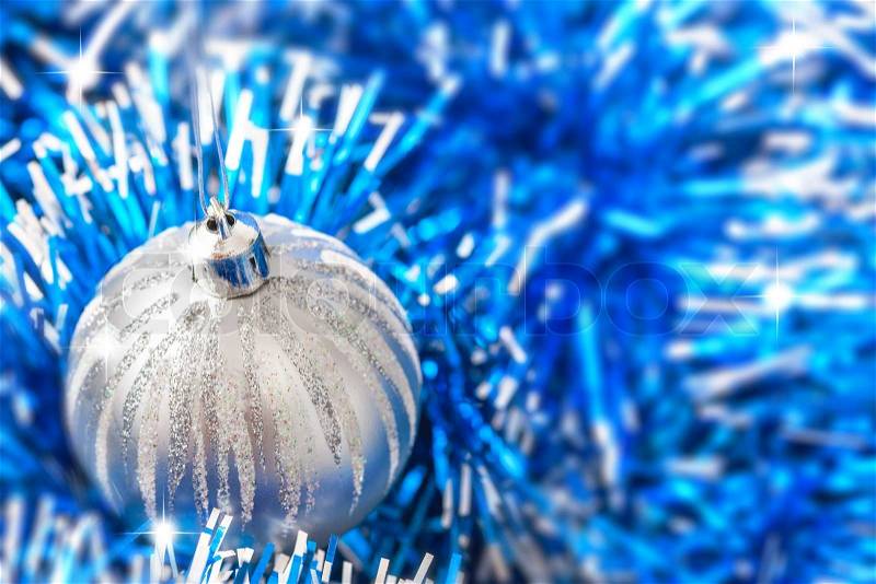 Blue and silver xmas ornaments on bright holiday background , stock photo