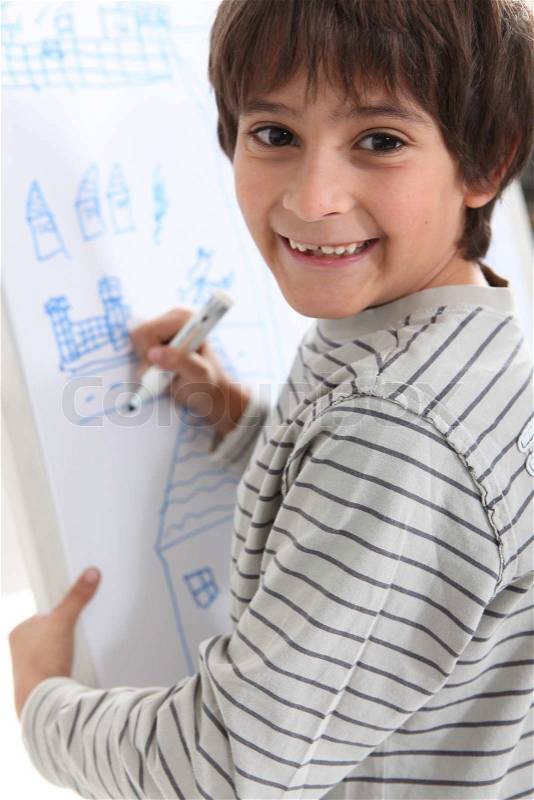 Child drawing on a whiteboard, stock photo