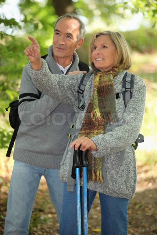 Old people hiking, stock photo