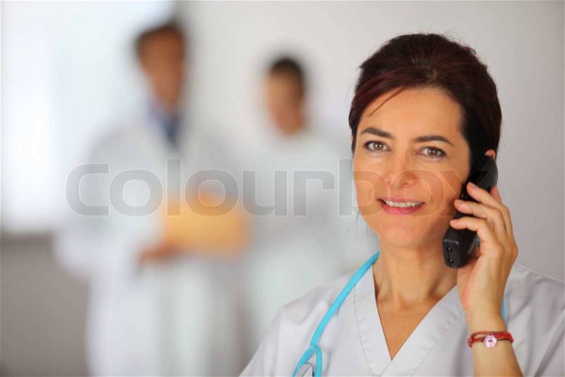 Nurse on the phone, stock photo