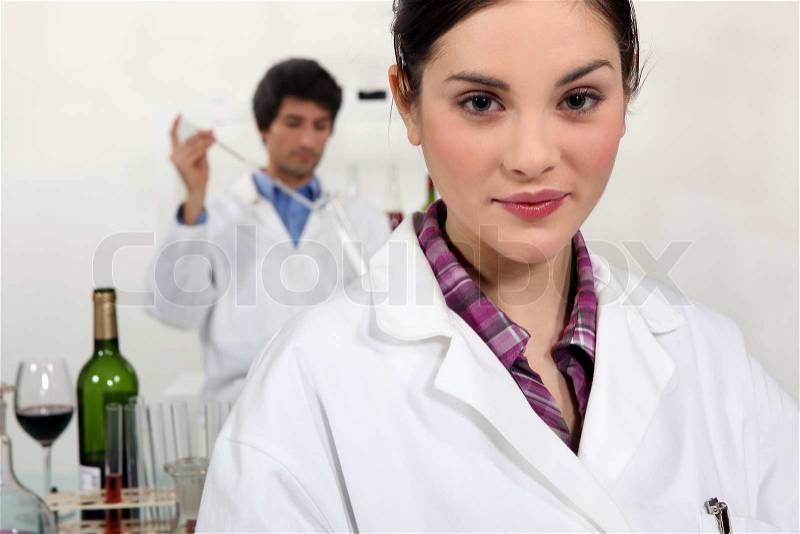 Two scientists testing wine, stock photo