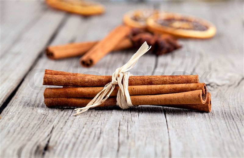 Cinnamon sticks, close up on wooden table, stock photo
