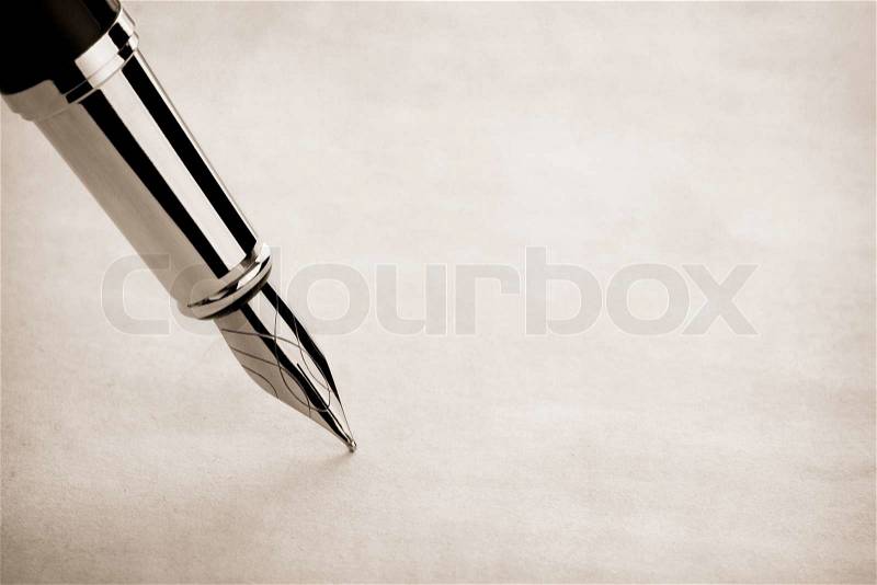 Ink pen and parchment, stock photo
