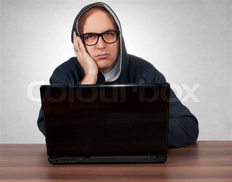 Man bored siting on the table, stock photo