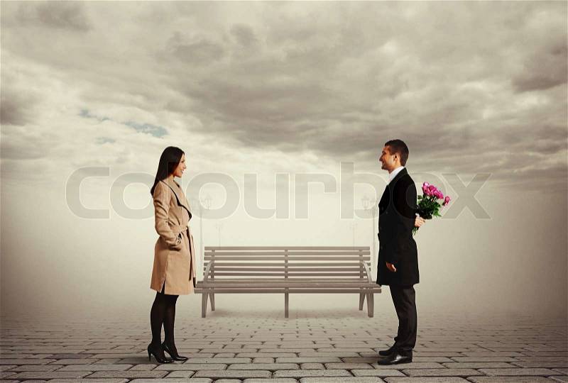 Beautiful smiley couple on the date in park, stock photo