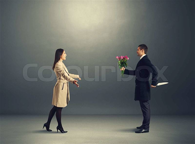 Crafty man with flowers and knife waiting young woman, stock photo