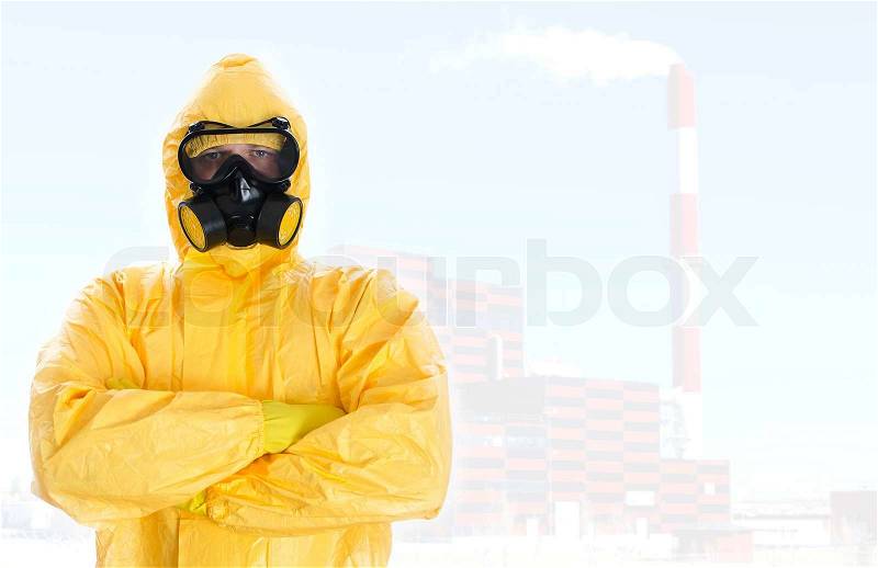 Worker in protective chemical suit. Space for your text, stock photo