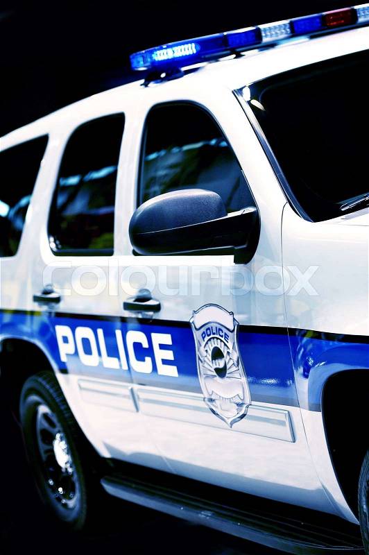 Police Car SUV Partial - Police Cruiser on Black Background. Transportation and Traffic Safety Photo Collection, stock photo
