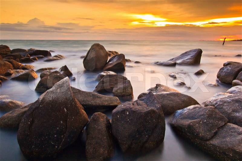 Rocks, sea, sunset on theTropical sea beach, stock photo
