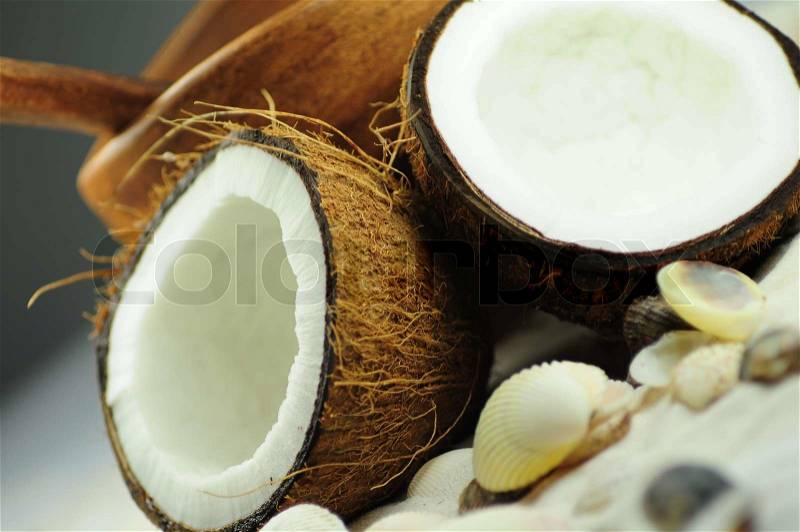Coconuts and Shells. Wooden Bowl in the Background, stock photo