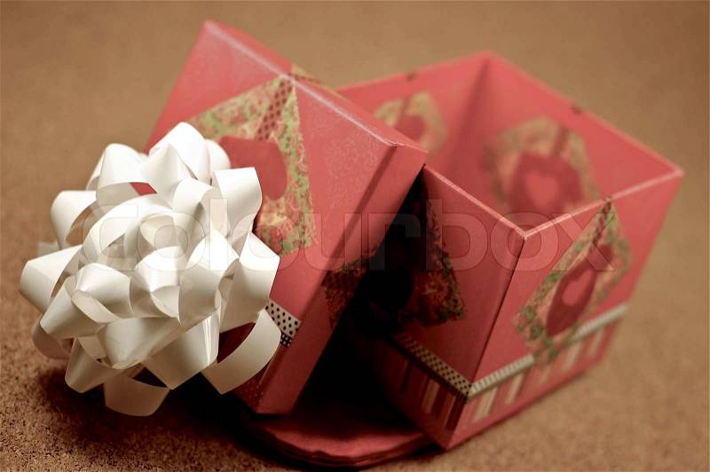 Open Gift Box. Opened Gift Bow with White Bow on the Top. Small Gift Box, stock photo
