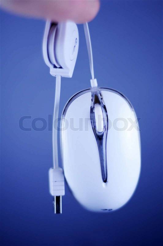 White Wired PC Mouse with USB Cable. Dark Blue Background. , stock photo