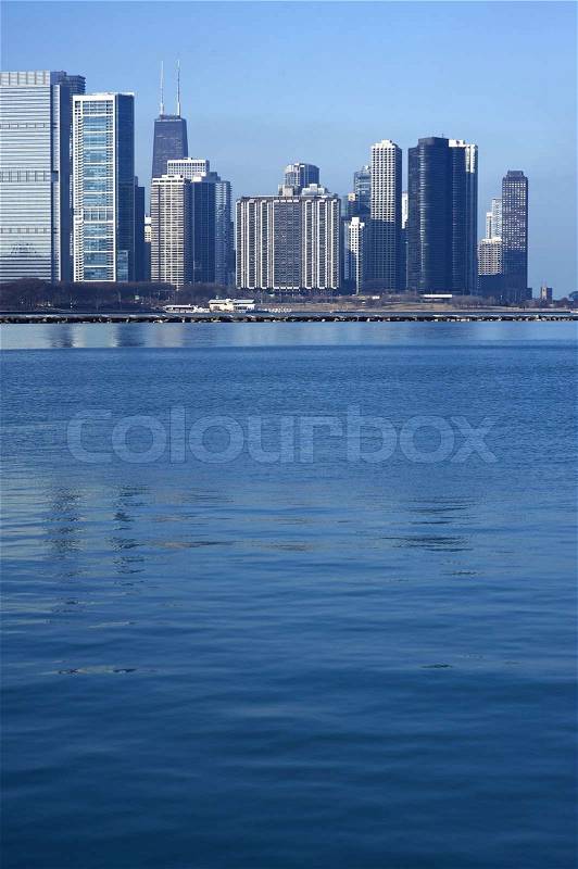 Lake Michigan and Chicago Part of the Skyline. Calm Lake Michigan Water. Vertical Photography, stock photo