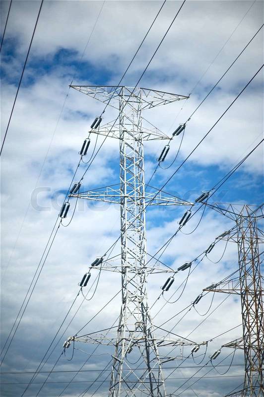 High Voltage Pole on the Blue Sky. High Voltage Electric Systems, stock photo