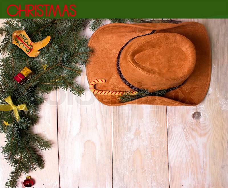 Cowboy christmas on wood background for text or design, stock photo