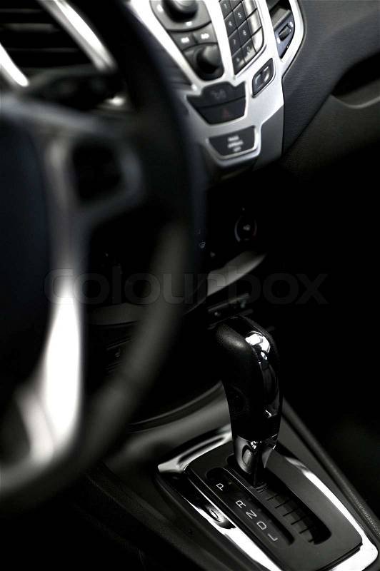Vehicle Transmission Stick with Chrome Decoration Elements. Modern Vehicle Interior, stock photo