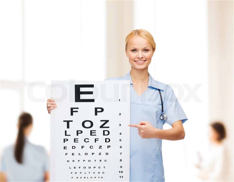 Healthcare, medicine, advertisement and sale concept - smiling female doctor or nurse with stethoscope and eye chart, stock photo