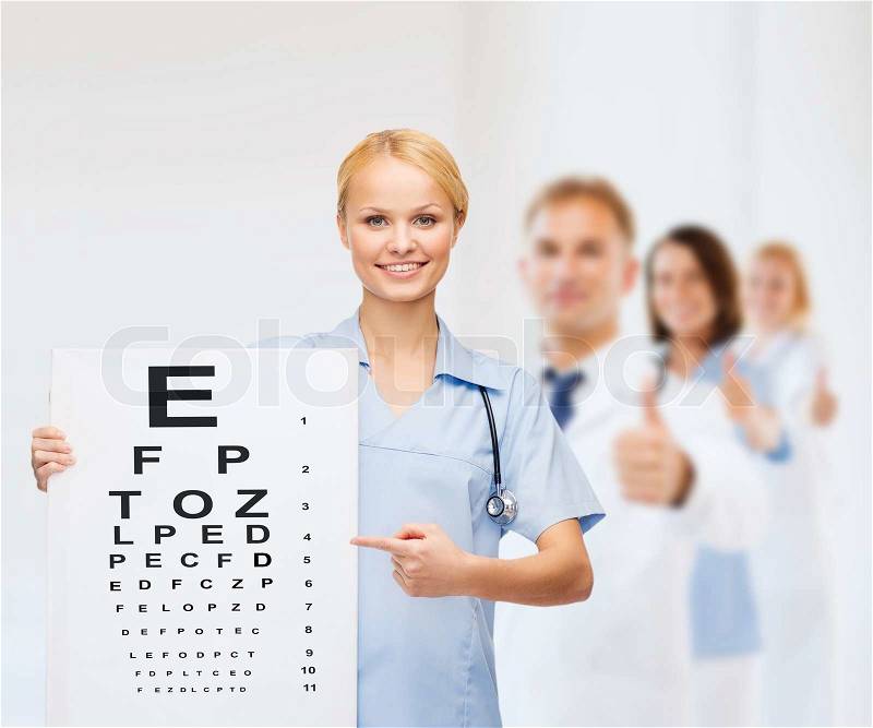 Healthcare, medicine, advertisement and sale concept - smiling female doctor or nurse with stethoscope and eye chart, stock photo