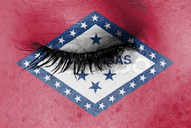 Crying woman, pain and grief concept, flag of Arkansas, stock photo