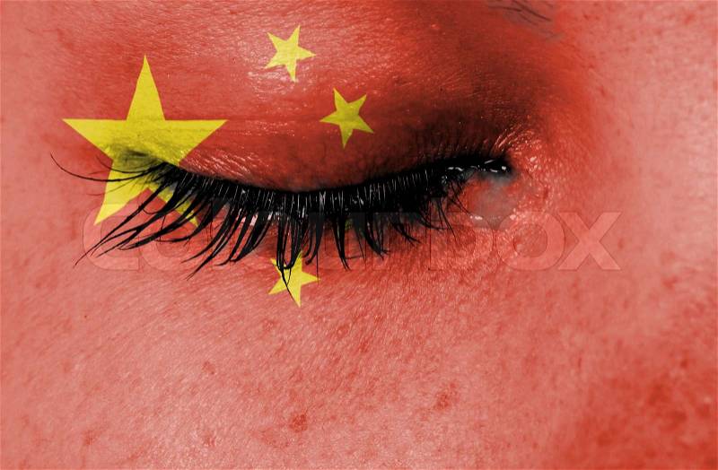 Crying woman, pain and grief concept, flag of China, stock photo