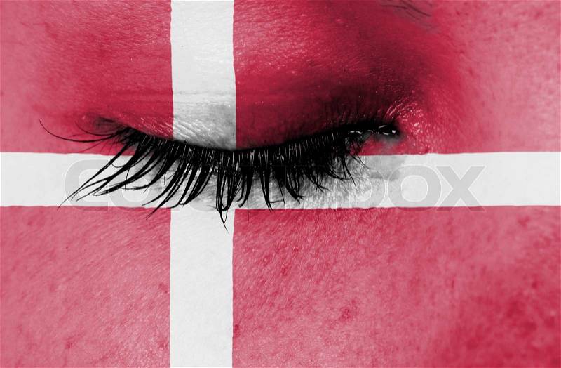 Crying woman, pain and grief concept, flag of Denmark, stock photo