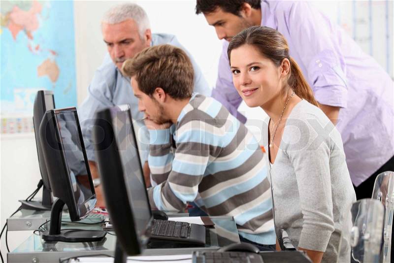 Young people working at computers, stock photo