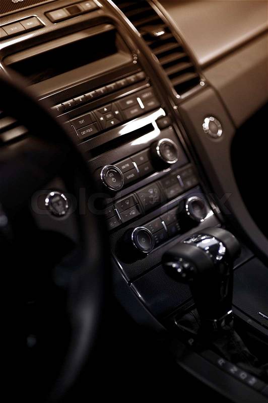 Car Dash. Modern Vehicle Dashboard - Central Console Vertical Photo. Multimedia Center, Climate Control and Automatic Transmission Stick Shift, stock photo
