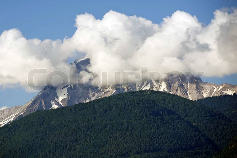 Cloudy Summit - British Columbia, Canada Mountains. Clouds Covering The Summit. Mountains Photo Collection, stock photo