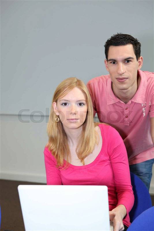 Teen couple with portable computer, stock photo