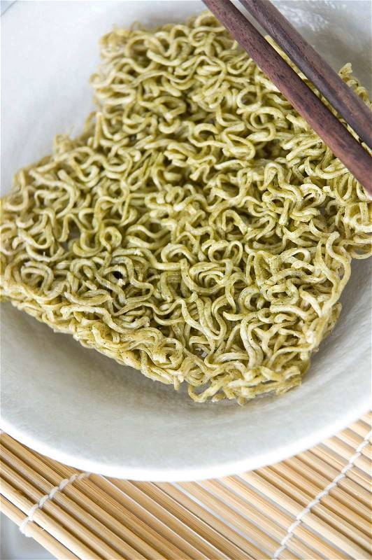 Green instant noodle in bowl, stock photo