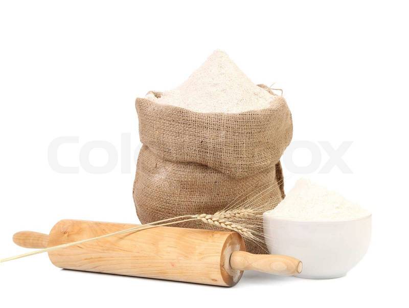 White flour and rolling pin. Isolated on a white background, stock photo