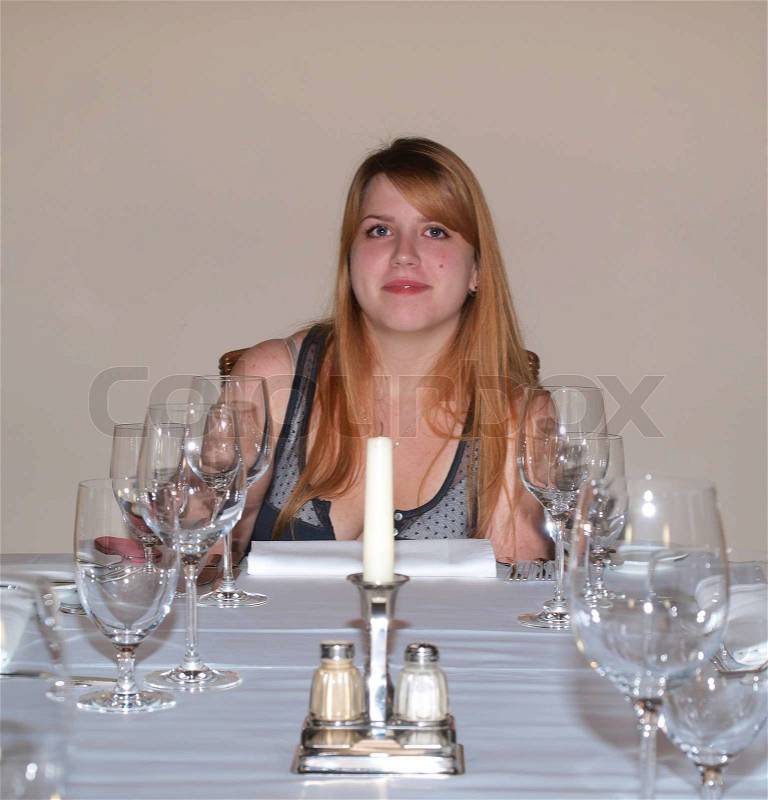 Teen girl in restaurant, stock photo