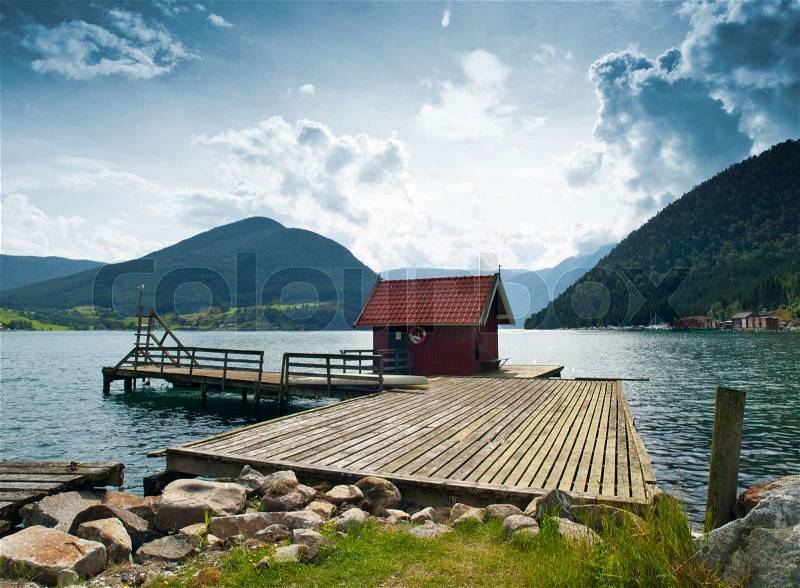 Wood cabin in the dock of Kaupanger, Norway, stock photo