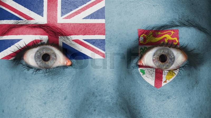 Close up of eyes. Painted face with flag of Fiji, stock photo