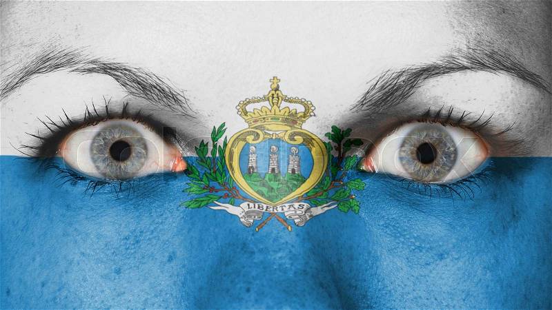 Close up of eyes. Painted face with flag of San Marino, stock photo