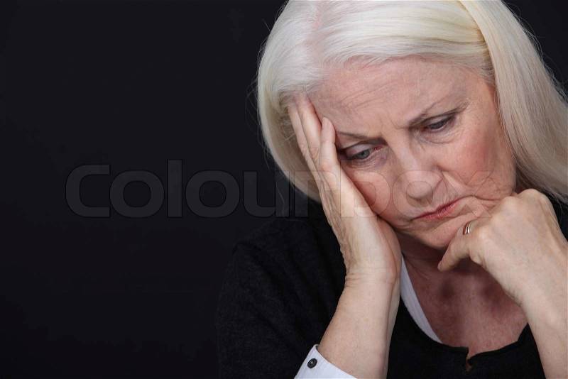 Elderly lady in pain, stock photo