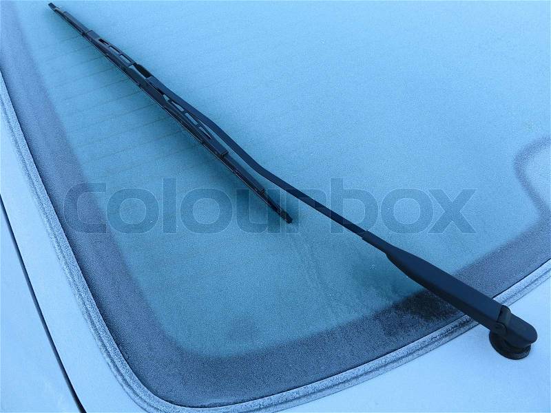 Rear window of a frozen automobile a Danish November morning, stock photo