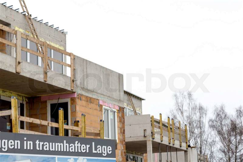 Construction site, sign, condos in a fantastic location, symbol photo for home ownership, and housing subsidies and investment, stock photo