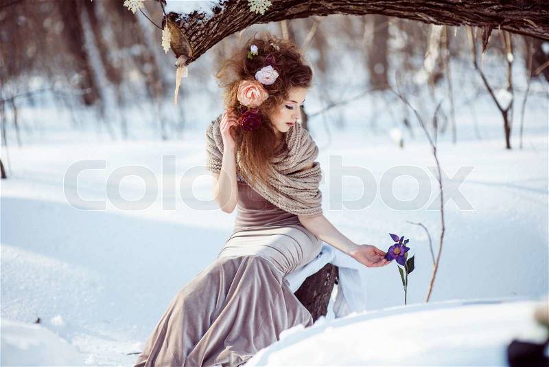 Fashion shoot of young beautiful girl in the winter forest , stock photo