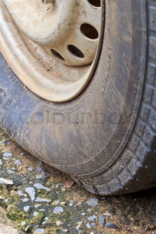 Flattire on car closeup shot of a flat tire of a car, stock photo
