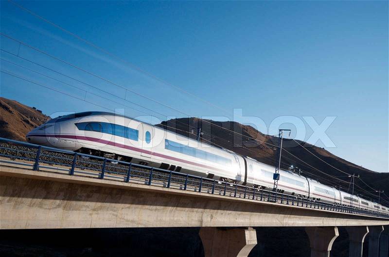 View of a high-speed train crossing a viaduct in Purroy, Saragossa, Aragon, Spain AVE Madrid Barcelona, stock photo