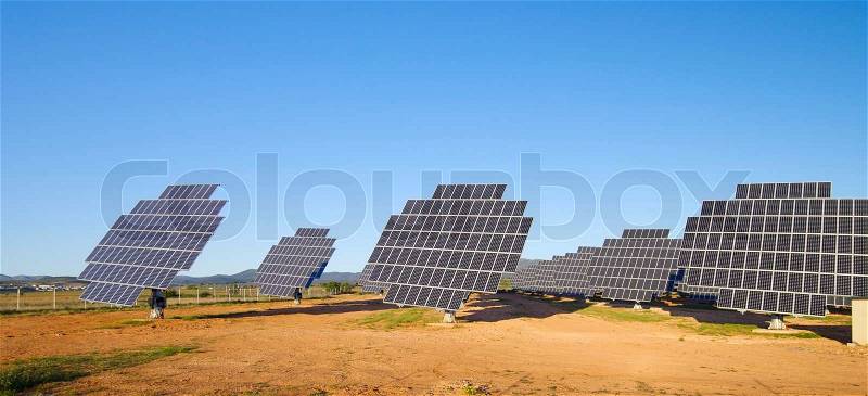 Sunrise over a field of solar electric production in Saragossa, Aragon, Spain, stock photo