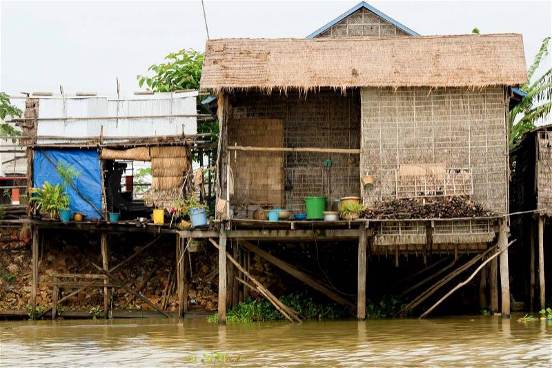 Traditional fishermen wooden houses on stilts. Tonle Sap Lake in Cambodia, Kompong Khleang village, stock photo