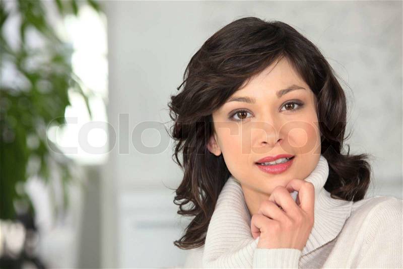 Woman wearing a high-necked sweater, stock photo