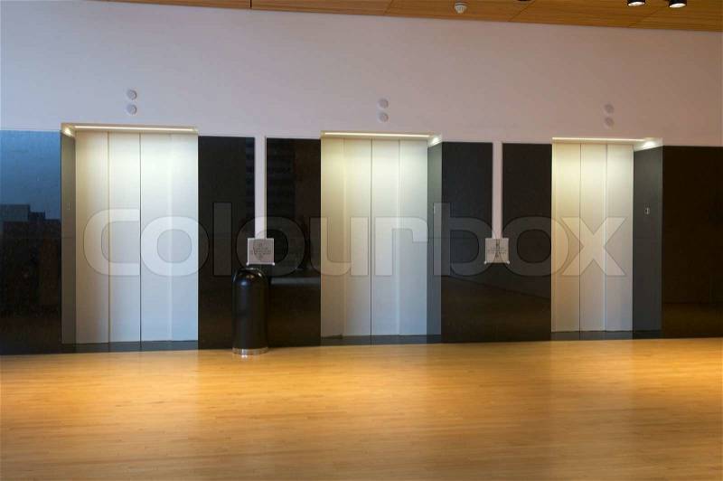 Three elevators in the interior of a building, stock photo